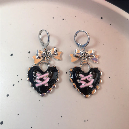 Lace up black heart earrings